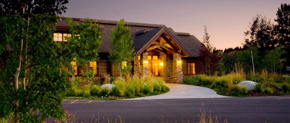 Rivers Crossing clubhouse lodge with timber and stone